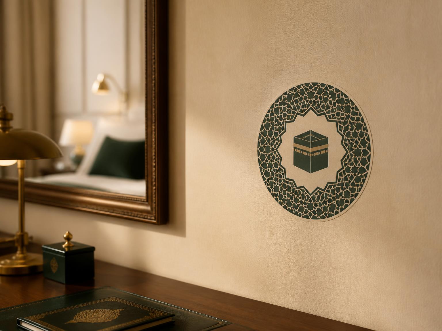 Emerald and cream Qibla Buoy sticker with a geometric border on a hotel room wall